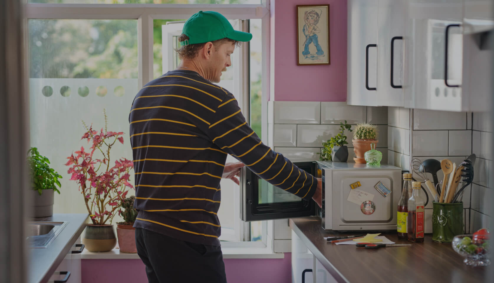 A Hive Plug being used by a household device in a kitchen.