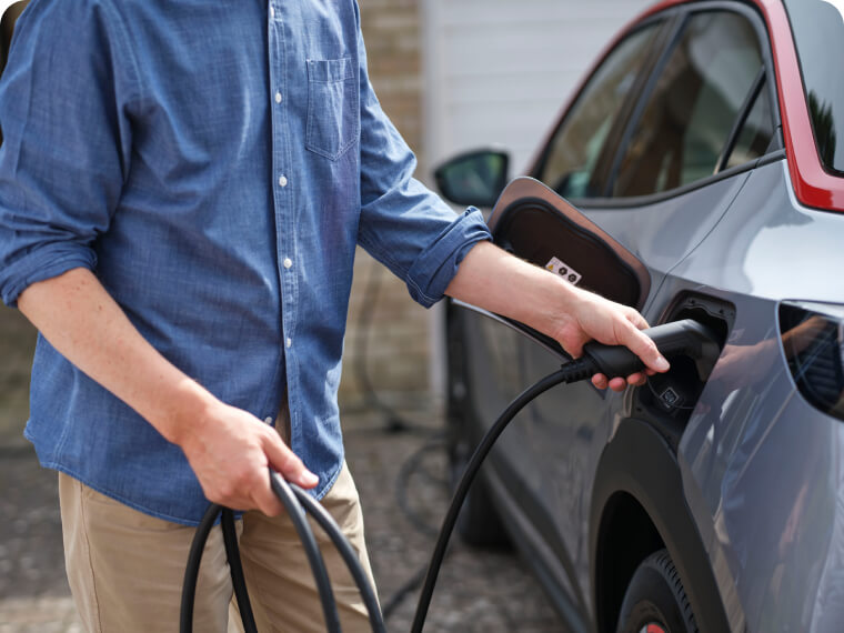 A British Gas engineer charging at a British Gas installed EV charging point.